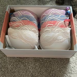 5 bras with colors of bright pink, light ocean blue, tan, white, and violet.